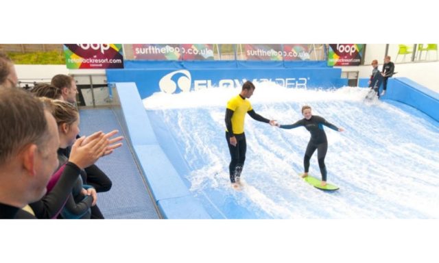 Riding a wave at Retallack Flowrider in Cornwall
